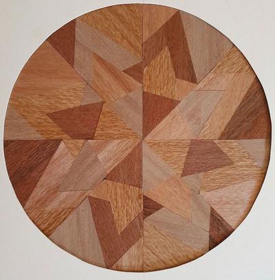 wooden circle with concurrent triangular patterns